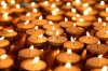 9131823-many-little-candles-burning-in-the-dark.jpg